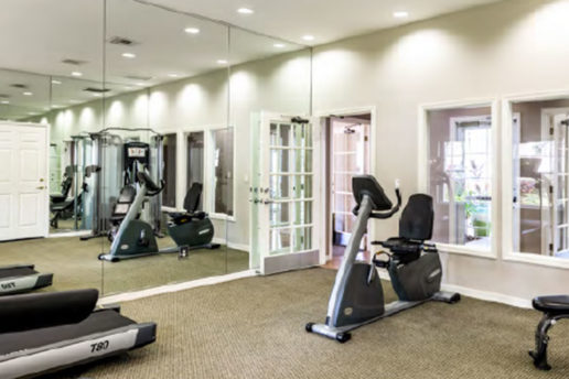 fitness center with mirrored walls